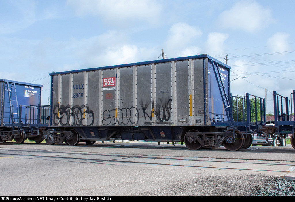 VULX 8858 is one of many identical hoppers on a westbound stone train 